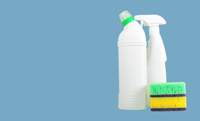 Chemical cleaning detergents in blank clean plastic bottles and washing sponges. Ad banner background with copy space for text