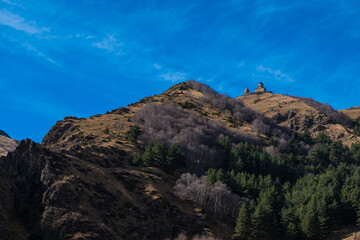 Georgia : 10-11-2022 : Country of Georgia, Kazbegi, Panoramic landscape of beautiful natural mountains, view of amazing Caucasus mountain peaks and meadows in Kazbegi national park