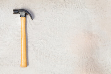 top view tool kit of one hammer with copy space on concrete background