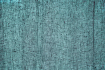 Closeup blue turquoise upholstery fabric texture for curtain, furniture, walls, clothes irregular abstract pattern. Cloth of natural cotton, linen textile material. Canvas design decorative background