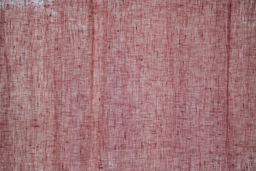 Closeup old pink colou upholstery fabric texture for curtain, furniture, walls, clothes irregular abstract pattern. Cloth of natural cotton, linen textile material. Canvas design decorative background