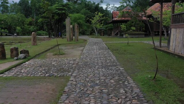 showing camera movement forward, cobbled road, archaeological site at Bumi Ragem Sai Mangi Wawai, Lampung Indonesia.