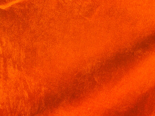 Orange velvet fabric texture used as background. Empty Orange fabric background of soft and smooth textile material. There is space for text...