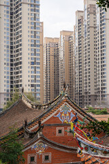 South Fujian historical red brick houses and modern skyscrapers in the same frame