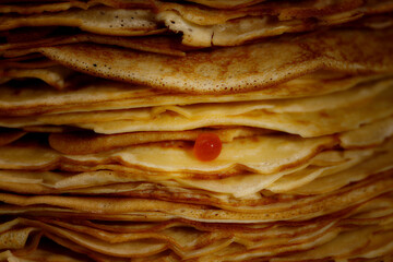 Caviar on pancakes, dark background, very appetizing, Russian cuisine, perfect food.