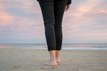 person walking on the beach, closeup of feet