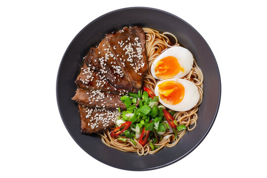 Ramen soup with beef, egg, chives isolated on transparent background, top view