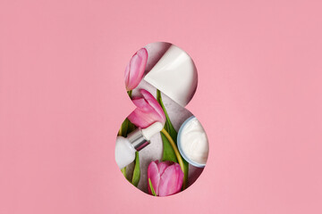 Eight march pink greeting card with tulips and cosmetics cream, essential oil , top view