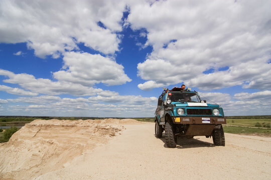 SUV rides on a sand quarry