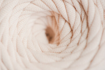 Fototapeta na wymiar Soft cotton knitted yarn noodles close-up
