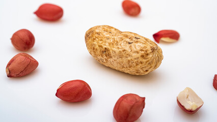 Peanuts in shell isolated on white background. Heap of peanuts close up	