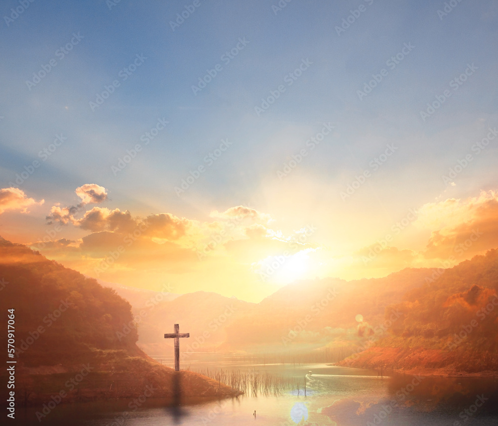 Wall mural the wooden cross on a mountain with a sunset background