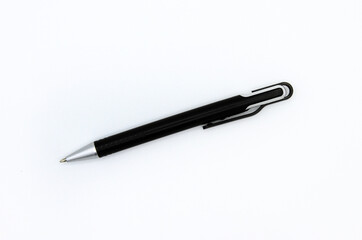 Flat lay of black modern pen or mechanical pencil isolated on white background. Top view of object for writing