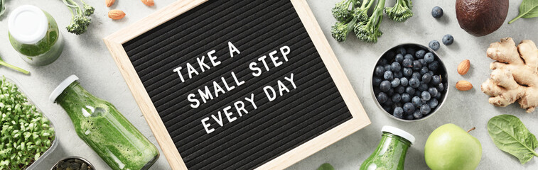 Take a small step every day letter board quote flat lay