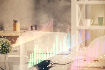 Double exposure of stock market graph drawing and office interior background. Concept of financial...
