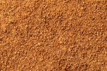 Golden palm sugar close up full frame as background