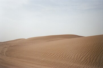 Fototapeta na wymiar sand dunes and sky in Dubai
