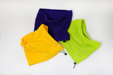 three multicolored scarves on a white background.