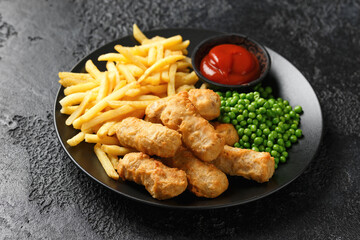 Irish battered sausages with potato fries, green peas and ketchup