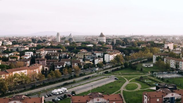 Drone panorama of Pisa, Italy, a medieval European tourist city center in Tuscany by sunset, 4K