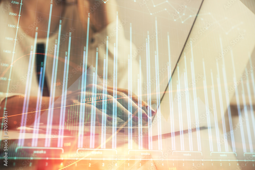 Poster multi exposure of woman hands typing on computer and financial graph hologram drawing. stock market 