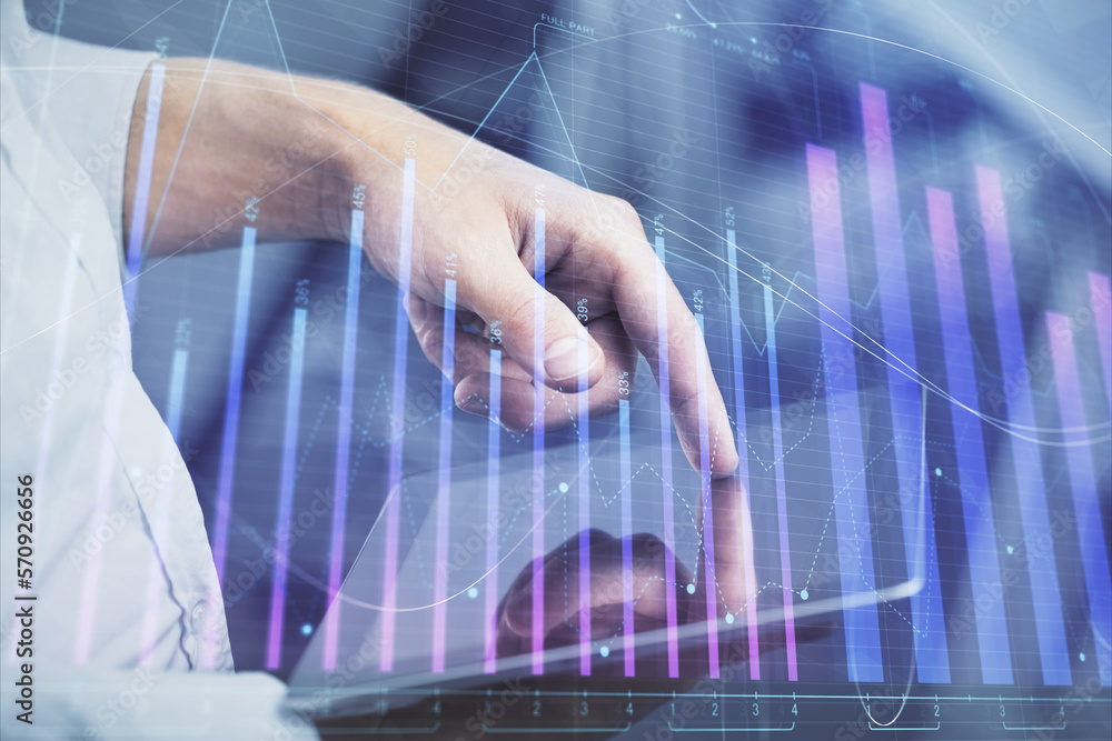 Aufkleber double exposure of man's hands holding and using a digital device and forex graph drawing. financial