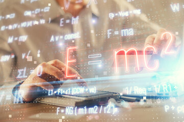 Double exposure of man hands holding a credit card and formula drawing. Education and E-commerce...