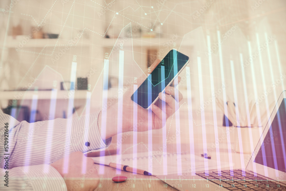 Poster double exposure of man's hands holding and using a digital device and forex graph drawing. financial