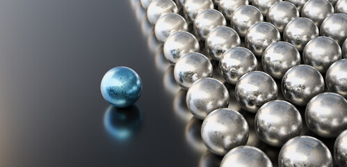 Leadership concept, blue leader ball, standing out from the crowd of silver balls, on black background. 3D Rendering