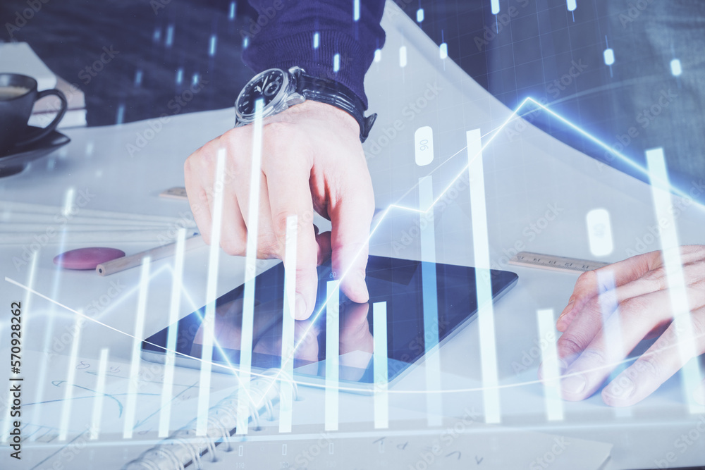 Poster double exposure of man's hands holding and using a digital device and forex graph drawing. financial