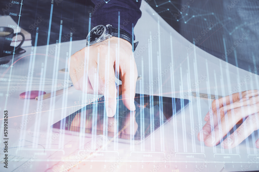 Aufkleber double exposure of man's hands holding and using a digital device and forex graph drawing. financial