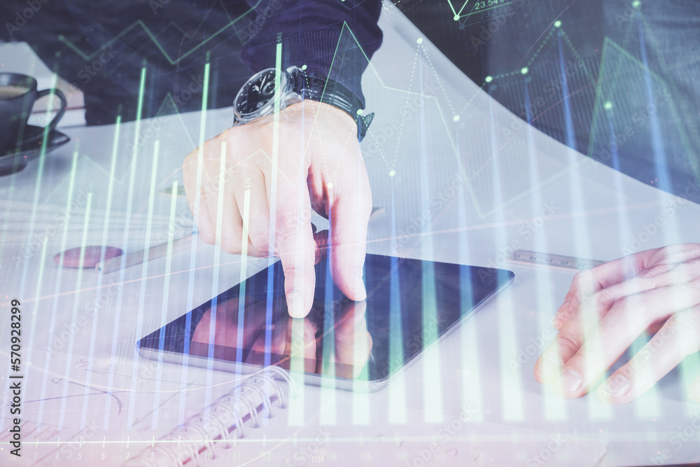 Poster double exposure of man's hands holding and using a digital device and forex graph drawing. financial