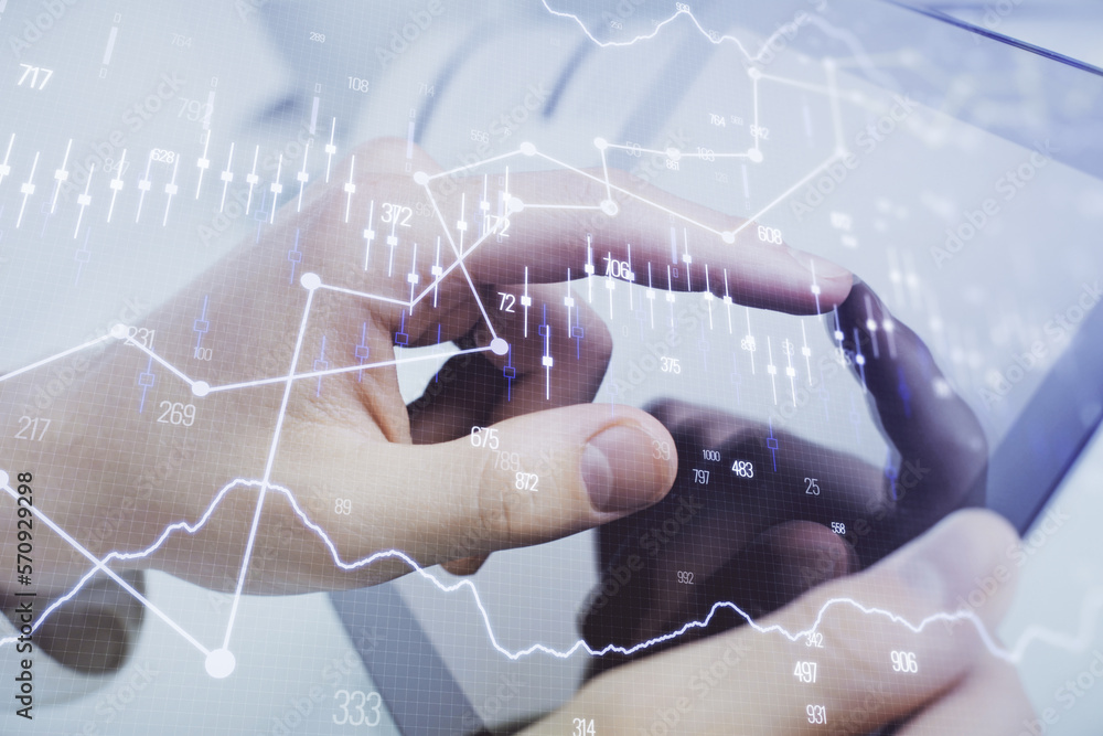 Poster multi exposure of man's hands holding and using a phone and financial chart drawing. market analysis