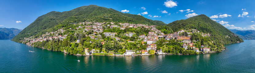 Fototapeta premium Aerial view of Nesso, a picturesque and colourful village sitting on the banks of Lake Como, Italy