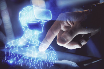 Double exposure of man's hands holding and using a digital device and AR glasses drawing. Virtual reality concept.