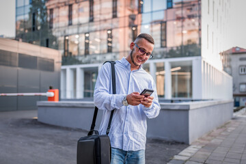 Young Businessman in the Street with Mobile Phone