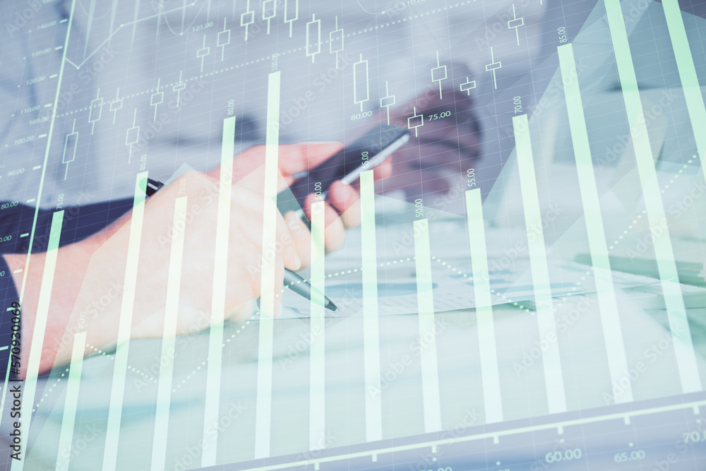 Poster double exposure of man's hands holding and using a phone and financial chart drawing. market analysi