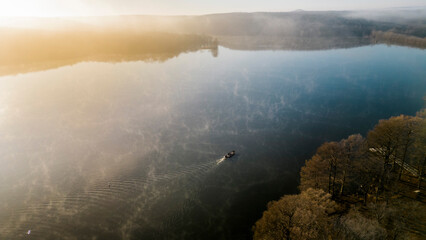 Bass Boat idling during a winter sunrise in oklahoma 
