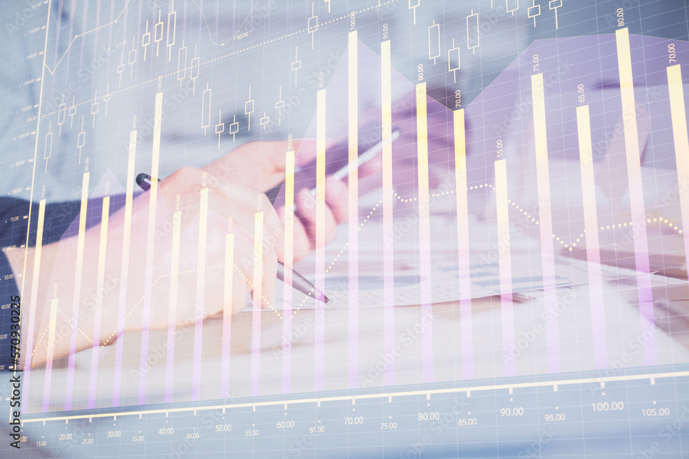 Aufkleber double exposure of man's hands holding and using a phone and financial chart drawing. market analysi