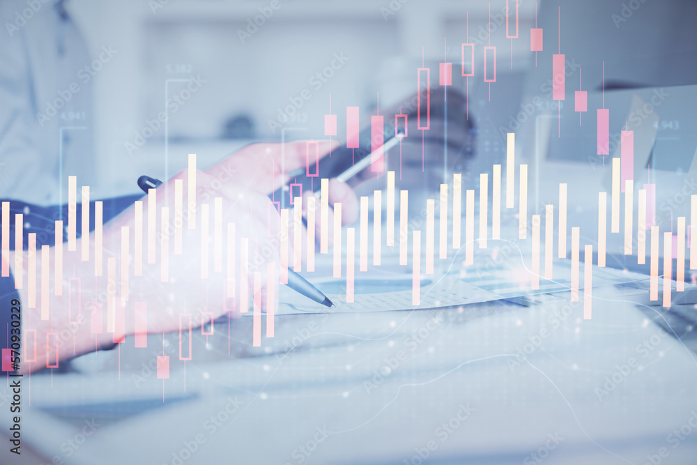 Poster double exposure of man's hands holding and using a phone and financial chart drawing. market analysi