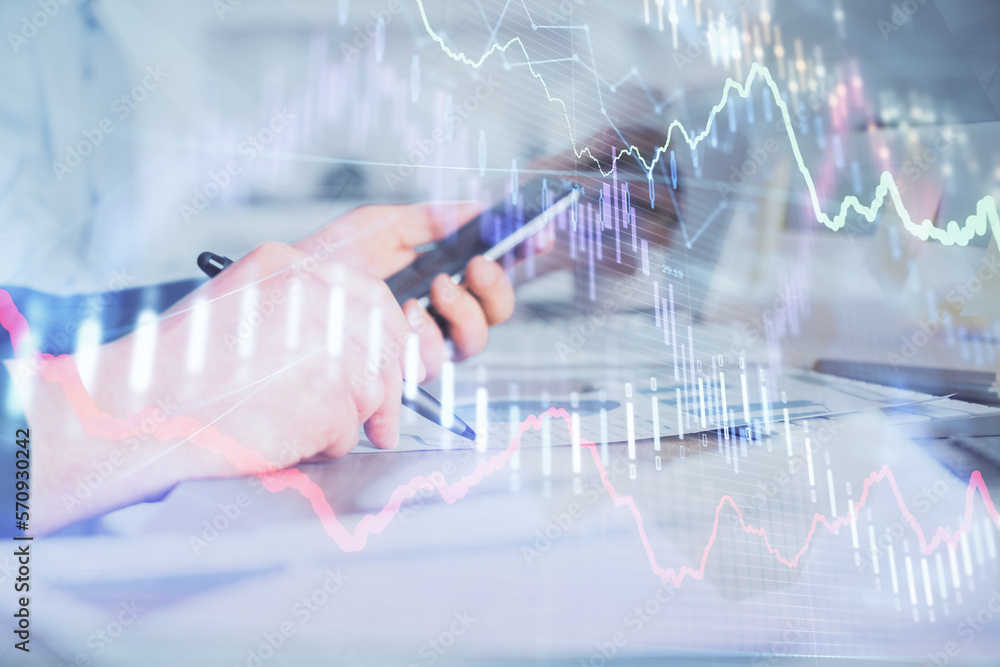 Aufkleber double exposure of man's hands holding and using a phone and financial chart drawing. market analysi