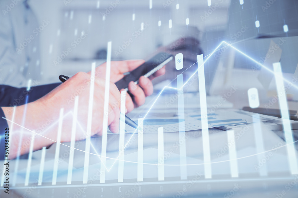 Poster double exposure of man's hands holding and using a phone and financial chart drawing. market analysi