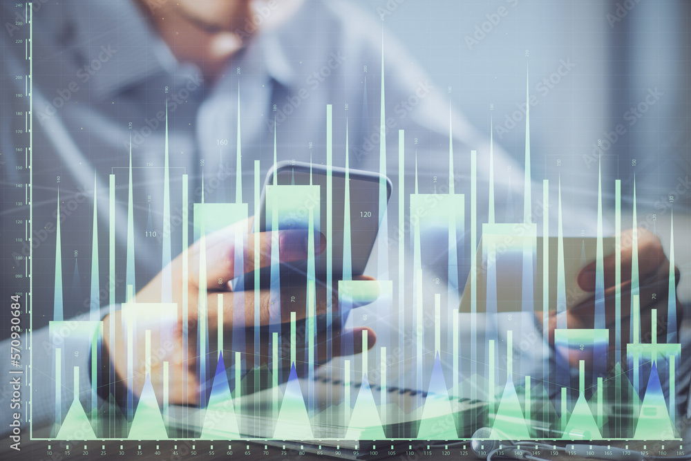 Poster double exposure of man's hands holding and using a phone and financial graph drawing. analysis conce