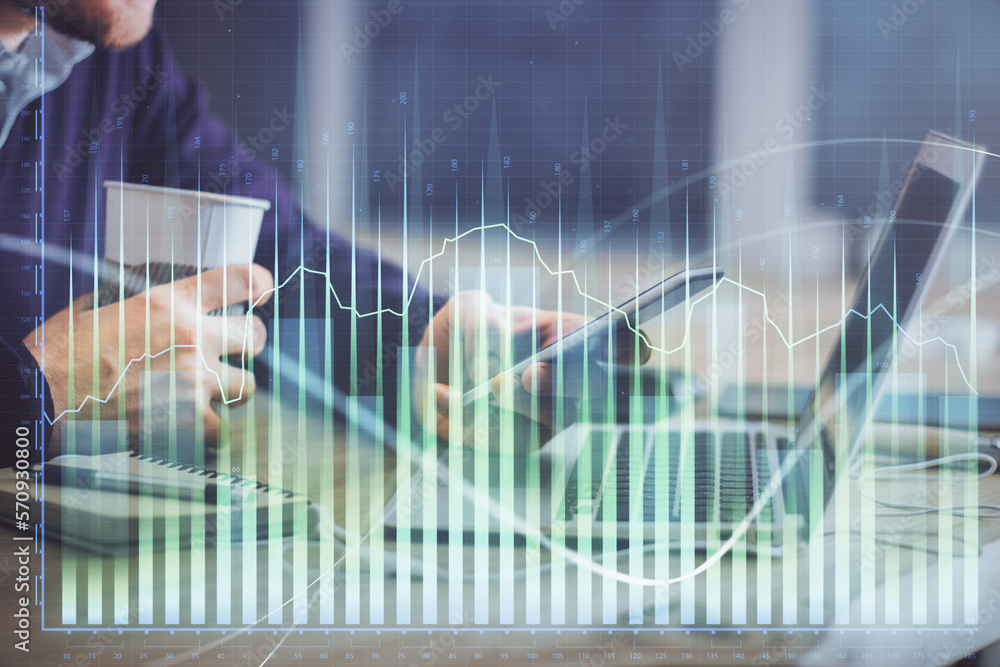 Poster double exposure of man's hands holding and using a phone and financial graph drawing. analysis conce