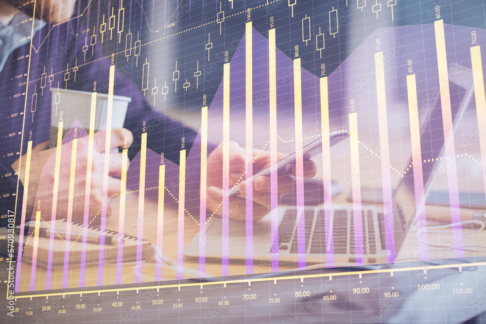 Poster double exposure of man's hands holding and using a phone and financial graph drawing. analysis conce