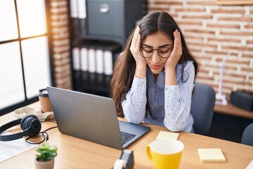 Young hispanic girl business worker stressed working at office