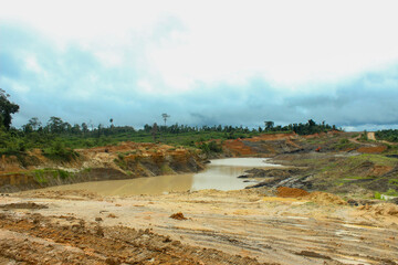 portrait of the condition of the coal mine site that is stagnant water is caused by excavation not according to procedures, resulting in environmental pollution