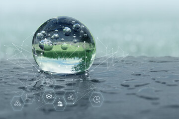 Glass ball on a wet surface. the concept of land, ecology. power engineering. Nature conservation....