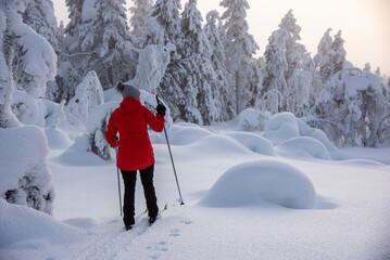 Woman cross country skiing in Lapland Finland