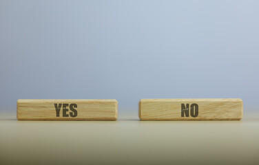 wooden block yes or no symbol and checkmark  Alternative concepts, decision making, and true and false test questions.